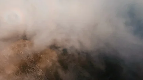 Aerial drone view through the clouds fog mist above the clouds Stock Footage 97064993