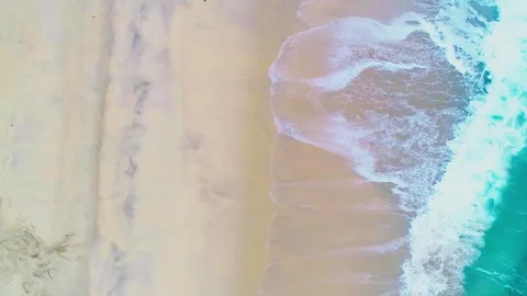 Aerial drone view top view footage waves crashing empty shore beach from abov Stock-Footage 253390851