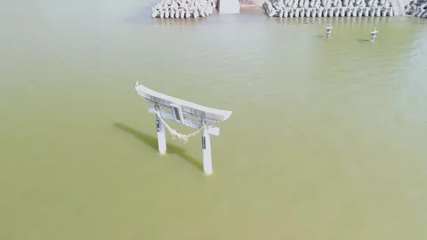 Aerial Drone View of a Torii Gate Standing in the Sea Stock Footage 336387469