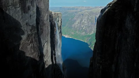Aerial drone view of towering granite cliffs at Kjerag above Lysefjord Norway. Stock Footage 328129382