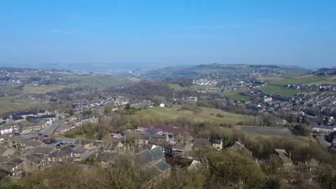 Aerial drone view of the town of Howarth in West Yorkshire with Oakworth Stock Footage 310274122
