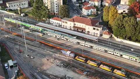 Aerial Drone View of Train Passing by Railway Station Stock Footage 319410006