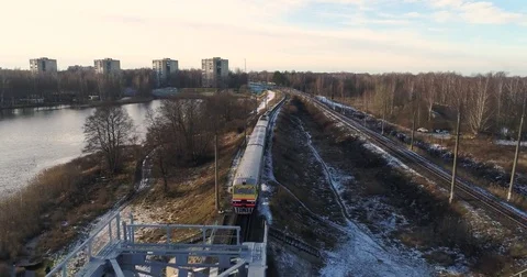 Aerial drone view of train in winter landscape in the city near the lake. 動画素材 84046345