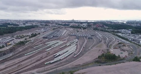 Aerial drone view of train yard with lots of train, railroads and warehouses. Stock Footage 79807979