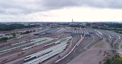 Aerial drone view of train yard with lots of train, railroads and warehouses. Stock Footage 79808051