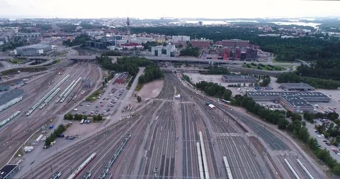 Aerial drone view of train yard with lots of train, railroads and warehouses. Stock Footage 79808074