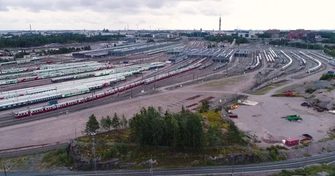 Aerial drone view of train yard with lots of train, railroads and warehouses. Stock Footage 79808228