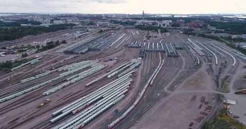 Aerial drone view of train yard with lots of train, railroads and warehouses. Stock Footage 79808465