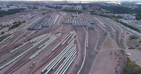 Aerial drone view of train yard with lots of train, railroads and warehouses. Stock Footage 79808752