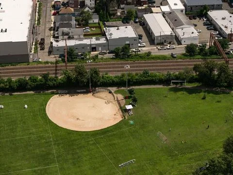 Aerial drone view of tree-lined residential neighborhood with detached homes Fotos de archivo