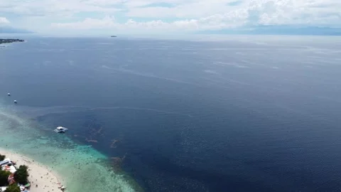 Aerial drone view of tropical White Beach in Moalboal Philippines with ocean Stock Footage 335394342