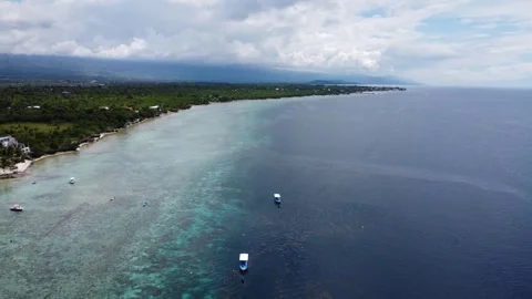 Aerial drone view of tropical White Beach in Moalboal Philippines with ocean 스톡 동영상 335394909