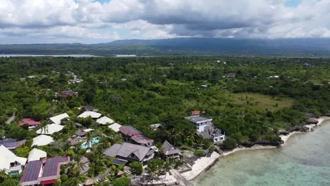 Aerial drone view of tropical White Beach in Moalboal Philippines with ocean Stock Footage 335394962