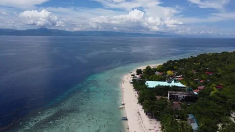 Aerial drone view of tropical White Beach in Moalboal Philippines with ocean 스톡 동영상 335394970