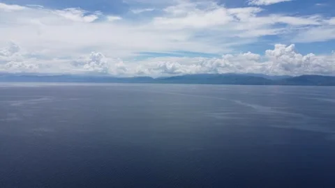 Aerial drone view of tropical White Beach in Moalboal Philippines with ocean Stock Footage 335395091