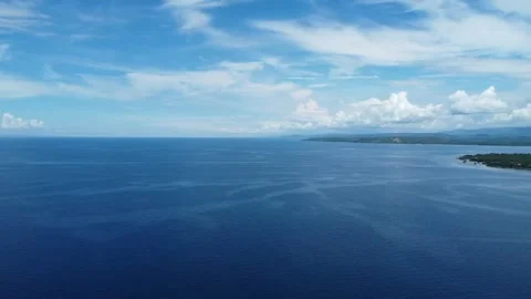 Aerial drone view of tropical White Beach in Moalboal Philippines with ocean Stock Footage 335395529