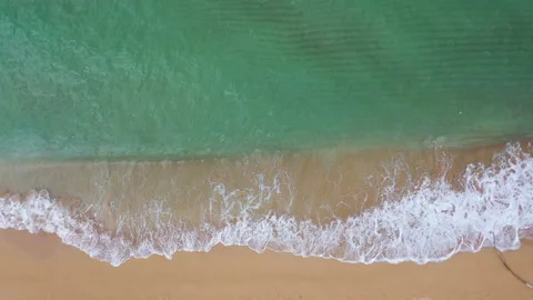 Aerial Drone view of Turquoise waves hitting the shore Video stock 318043854