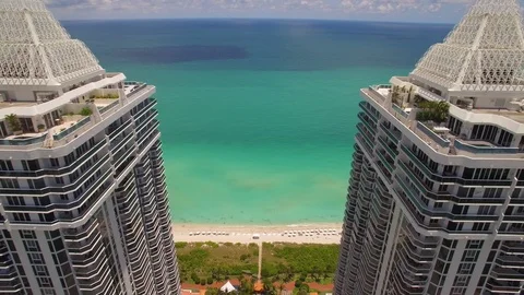 Aerial drone view of twin tower skyscraper in Miami Beach coastline Stock Footage 100877441