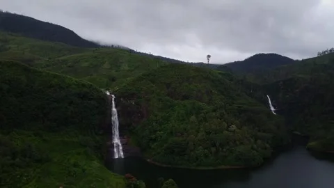 Aerial Drone View of Two Distant Waterfalls at Sunrise – Gartmore Falls, Sri Lan Video stock 306433010