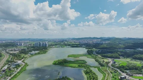 Aerial Drone View of Uiwang Station Cityscape and Wangsong Lake Park Stock Footage 342352936