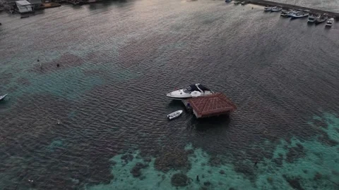 Aerial drone view of upscale island resort, floating accommodation and Stock Footage 342781587