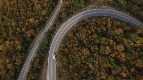 Aerial Drone View Van Driving on Curvy Mountain asphalt Road in autumn Video stock 254024417