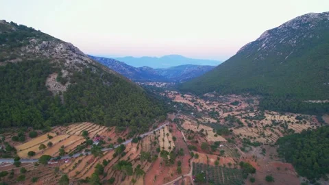 Aerial drone view video over green mountains Scenic road Stock Footage 228465043