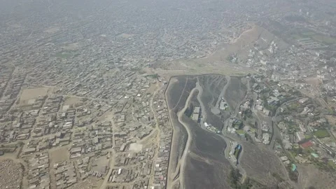 Aerial drone view of a wall that divides two districts 库存影片 143006240