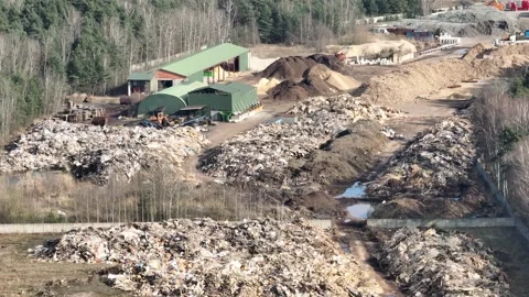 Aerial drone view of a waste dump on the edge of the forest, environmental .. Stock Footage 309957138