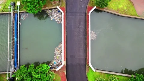 Aerial Drone View of Water Pollution and Rubbish Accumulated Along Water Banks Stock Footage 346820005