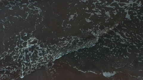 Aerial drone view waves on beach Coastline background of water UK England 4K Stock Footage 233669444