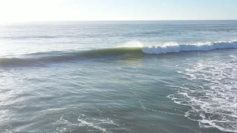 Aerial drone view of waves braking on a beach in Cadiz, Andalusia Stock Footage 164954251