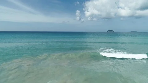 Aerial drone view of waves break on tropical white sand beach. Aerial drone view Stock Footage 103798121
