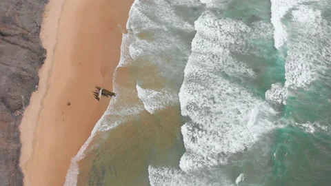 Aerial drone view of waves breaking on the beach ocean coastline waves sea. Stock Footage 136319082