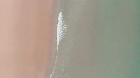 Aerial drone view of waves breaking on the beach ocean coastline waves sea. Stock Footage 136319297