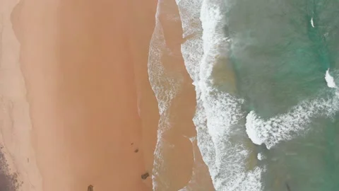 Aerial drone view of waves breaking on the beach ocean coastline waves sea. Stock Footage 136319689