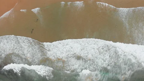 Aerial drone view of waves breaking on the beach ocean coastline waves sea. Stock Footage 136319854
