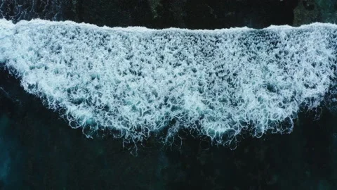 Aerial drone view of waves breaking and rolling Stock Footage 143512990
