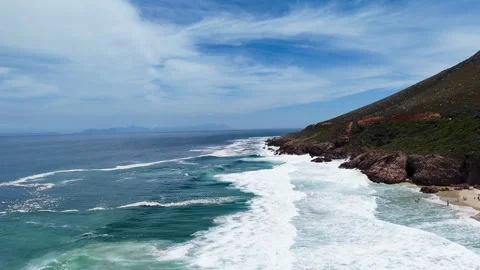 Aerial Drone View of Waves Breaking on Rocky Coastline at Kogel Bay Western Cape Stock Footage 329308956