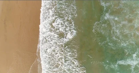 Aerial drone view of waves with foam in green sea Stock Footage 124375345