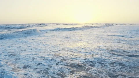Aerial drone view of waves foaming and splashing in the sea. Sunset wavy Stock Footage 155479278