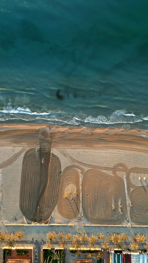 Aerial drone view of waves hitting the shore on the beach in Alicante, Spain. Stock Footage 314150606