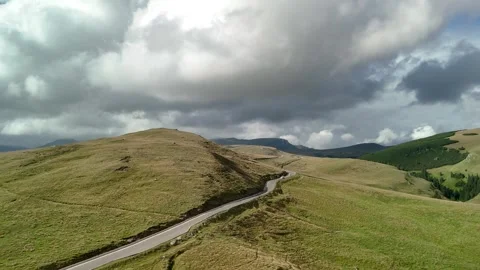 Aerial drone view of white van car driving on a curvy road Stock Footage 280288288