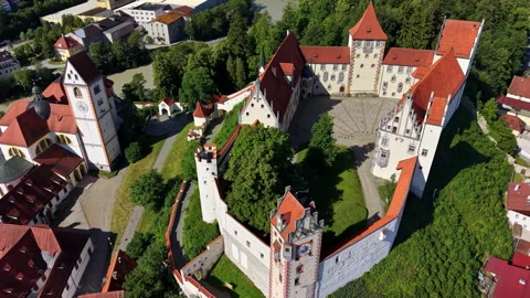 Aerial drone view of the white walls and painted windows of the Hohes Schloss Stock Footage 344936433