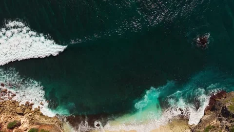 Aerial Drone View of White Waves Washing Over Sandy Coastline Stock Footage 340658944