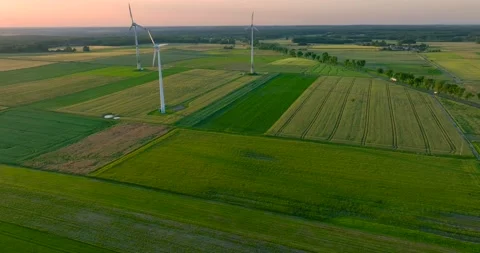 Aerial drone view of wind power turbines, part of a wind farm. Wind turbines  Stock Footage 198032370