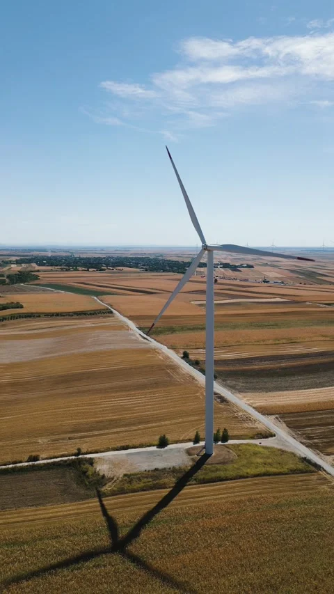 Aerial drone view of a wind turbine in a rural agricultural field Stock Footage 344601660