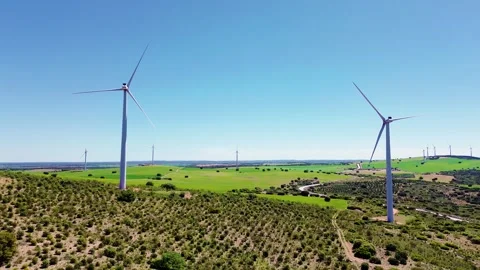 Aerial drone view wind turbines green field renewable energy landscape Stockbeeldmateriaal 334138281
