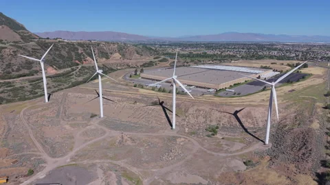 Aerial drone view of wind turbines generating power in Utah valley Stock Footage 340237573