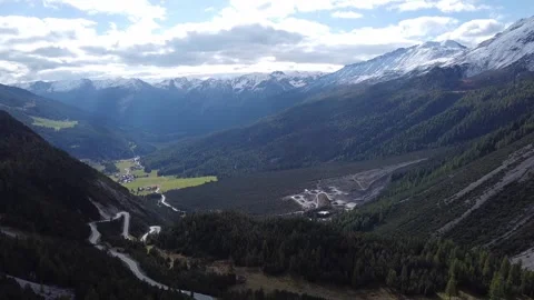 Aerial Drone View of Winding Mountain Road in Swiss Alps Valley Stock Footage 327974807